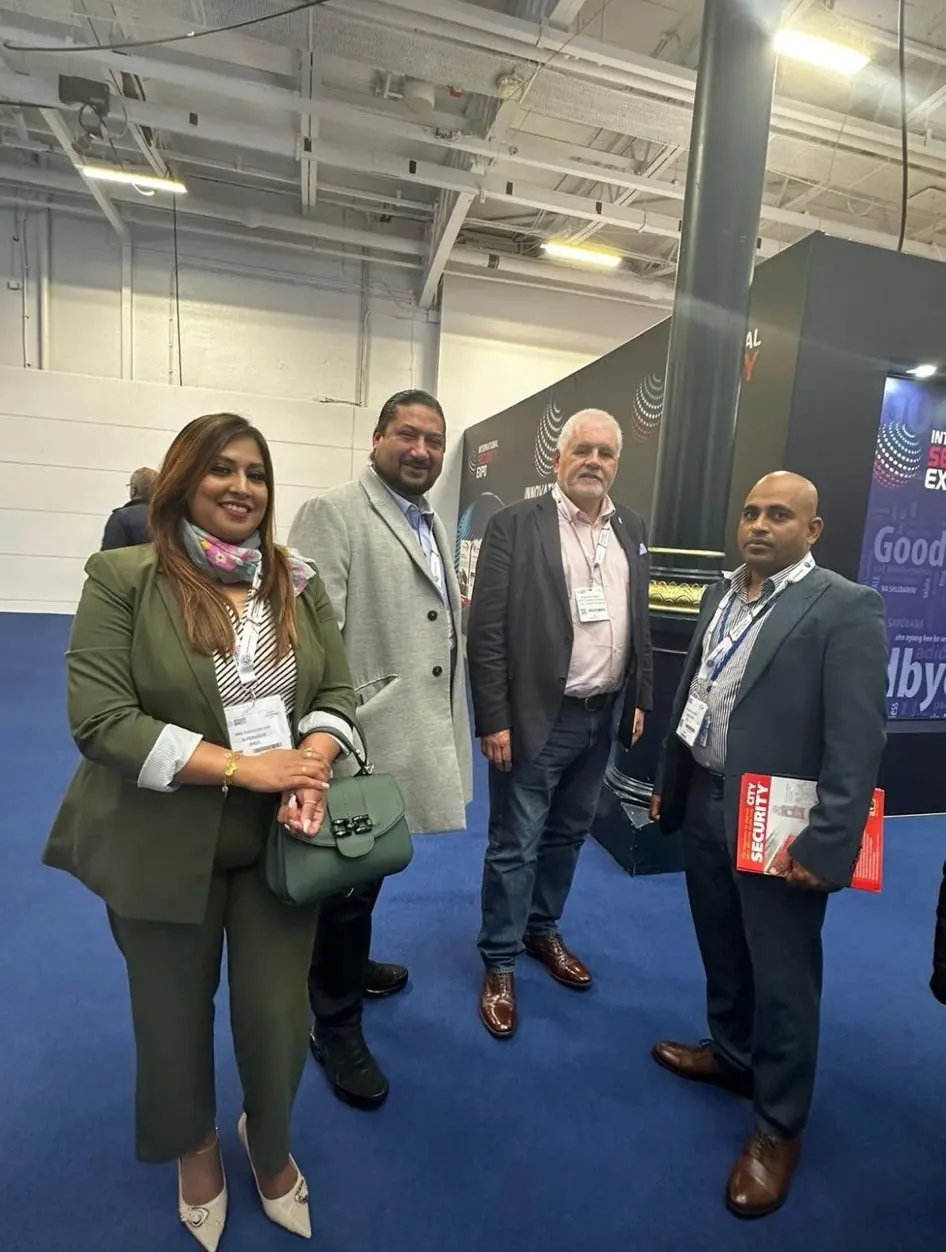 RMSS Ltd team members talking with colleagues at an exhibition hall
