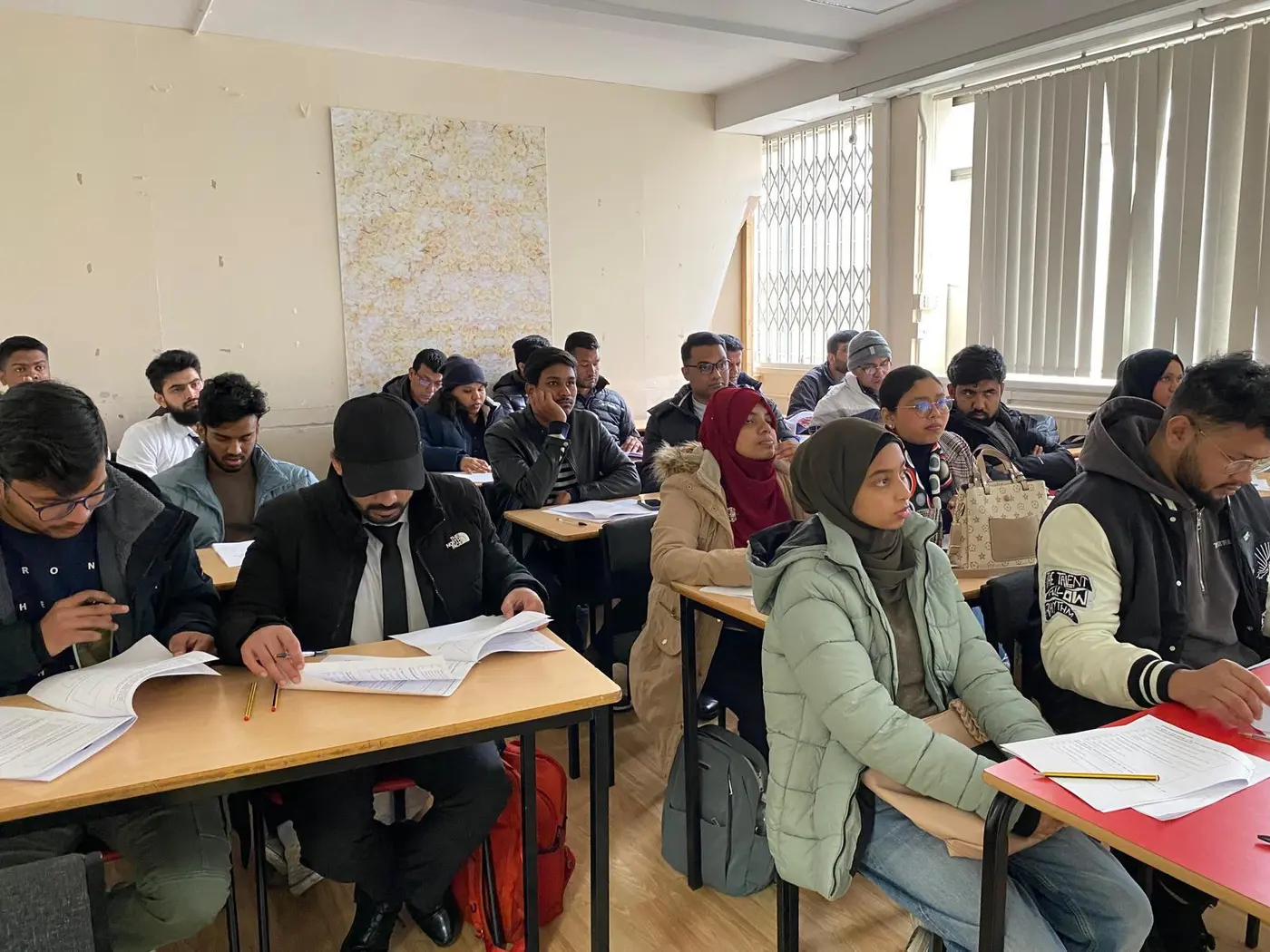 Classroom of trainees seated at desks