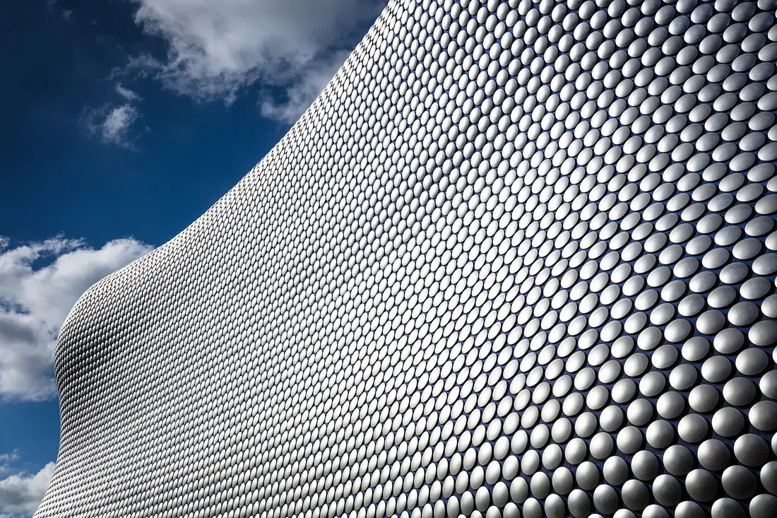 The curved, disc-covered facade of the Bullring shopping centre in Birmingham