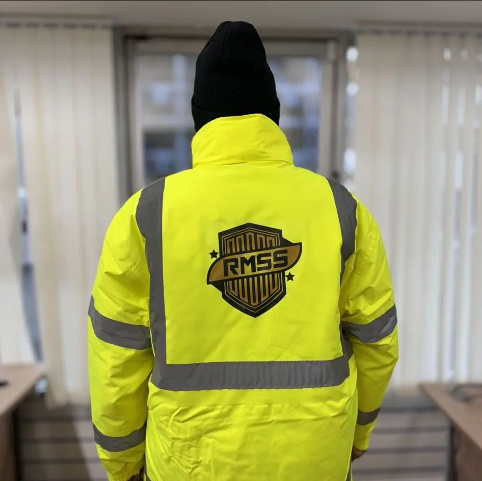 Back of a hi-vis jacket printed with the RMSS Ltd shield logo